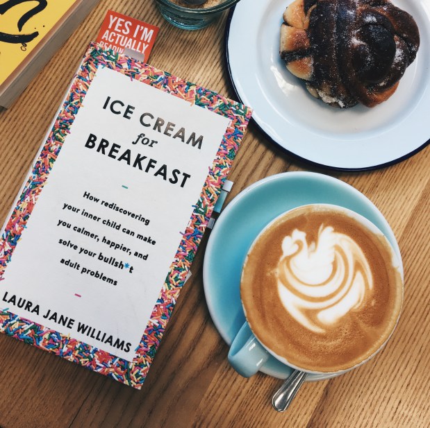 Laura Jane Williams's book, Ice Cream for Breakfast, on a coffee table with a coffee