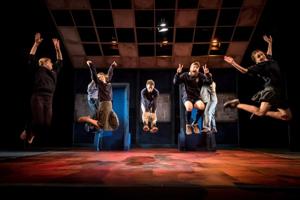 A wild and unruly class jump into the air