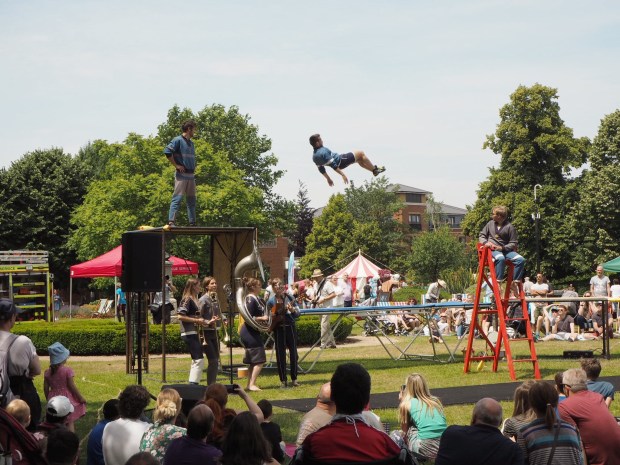 Acrobats perform on a trampoline
