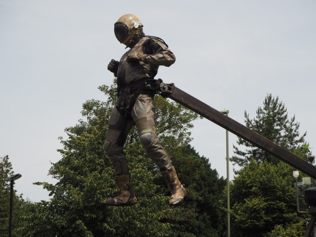 The urban astronaut is suspended 20ft in the sky, over the crowd
